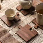 Wooden coasters in the shape of a jigsaw puzzle